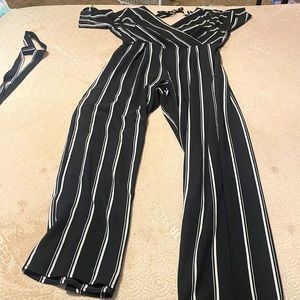 Only used once. The brand is Trixxi and it is a black and white XL romper.